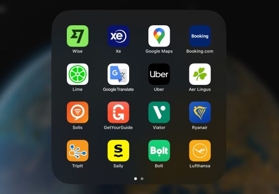 A collection of app icons on a dark background, including travel and navigation services.